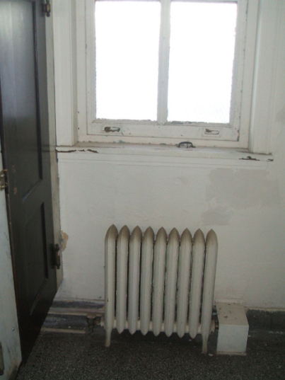 Radiator in Womens Bathroom before